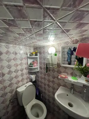 a bathroom with a toilet and a sink at Dar charfa in Fès