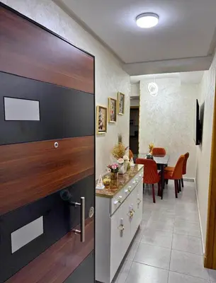 a kitchen with a large sliding door with a dining room at Alyassamine in Taza