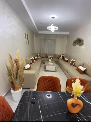 a large living room with a couch and a table at Alyassamine Taza in Settat