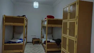 two sets of bunk beds in a room at Hostel Afgo Rooftop in Ouarzazate