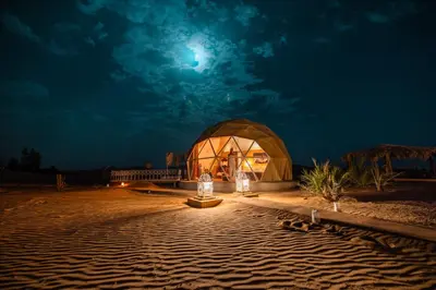 a dome tent in the desert at night at Sunrise Sahara Camp in Merzouga