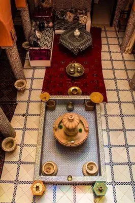 a table with a tea set on top of a floor at riad lala fatima in Ouzoud