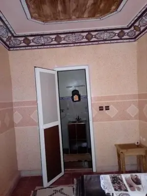 a room with a mirror and a ceiling at Gte Tawada - Valle Heureuse - Chambre pour 4 Personnes in Agouti