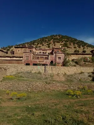 a large house on top of a hill at Gte Tawada - Valle Heureuse - Chambre pour 2 Personnes in Agouti
