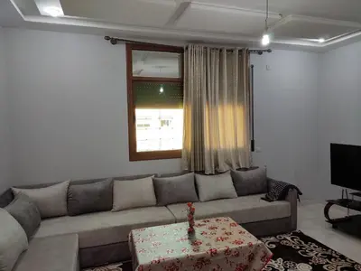 a living room with a couch and a table at The good stay 2 midelt in Midelt
