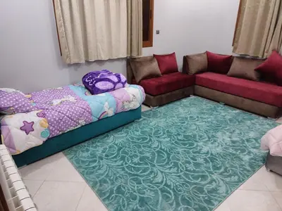 a living room with a bed and a couch at The good stay 2 midelt in Midelt
