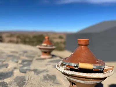 two fire hydrants sitting on top of a rock at Auberge camping café restaurant Relax Tazoulait in Bou Dib