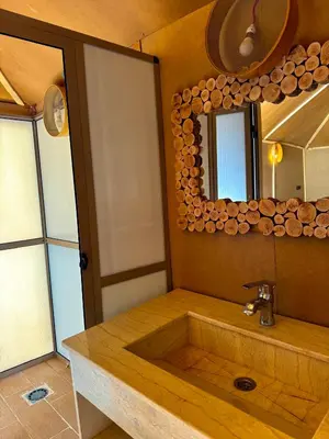 a bathroom with a sink and a mirror at Dream luxury camp in Merzouga