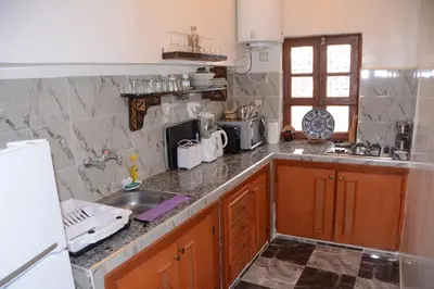 a kitchen with a sink and a counter top at Dar El Karam Fez in Fès